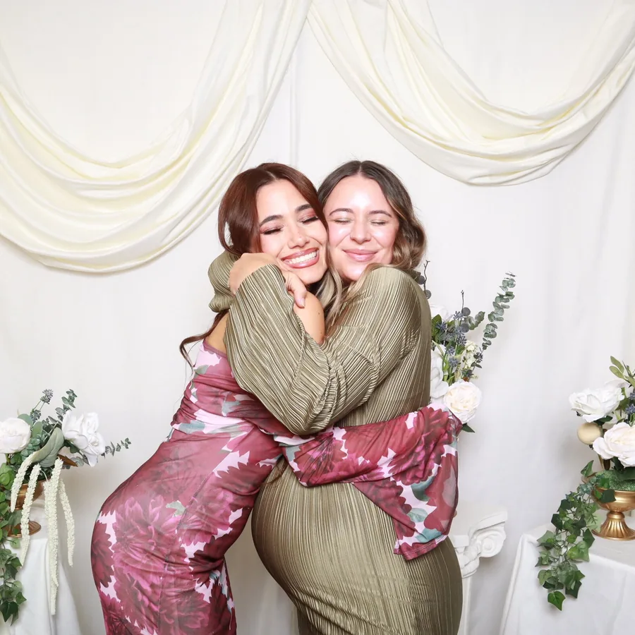 Wedding guests laughing together in a color Orlando wedding photo booth